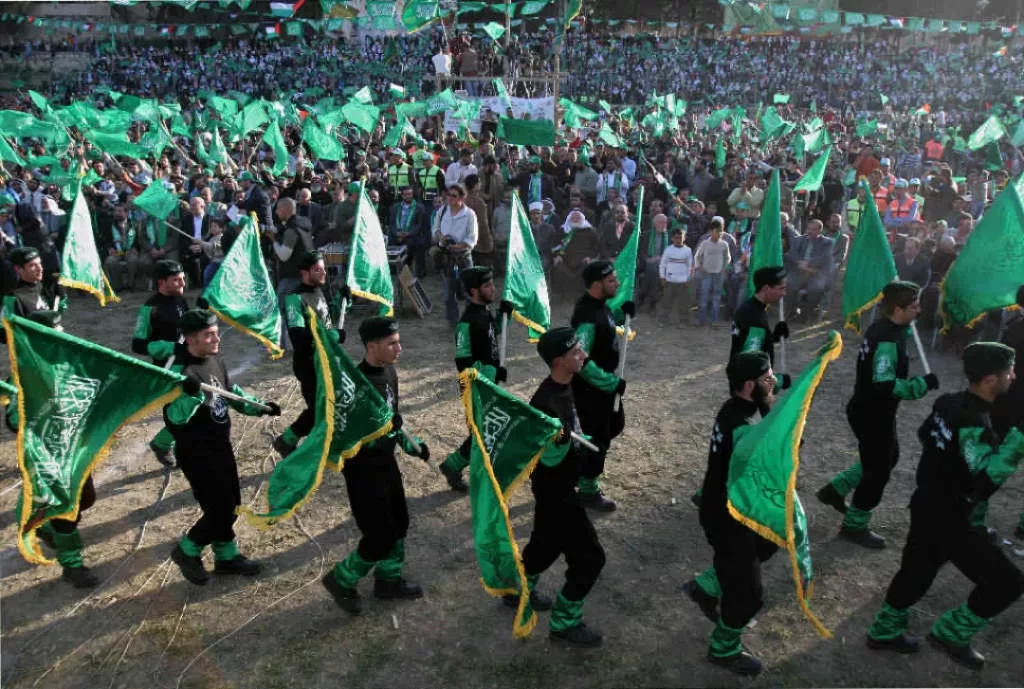 Palestinian Hamas supporters carry Islamic flags