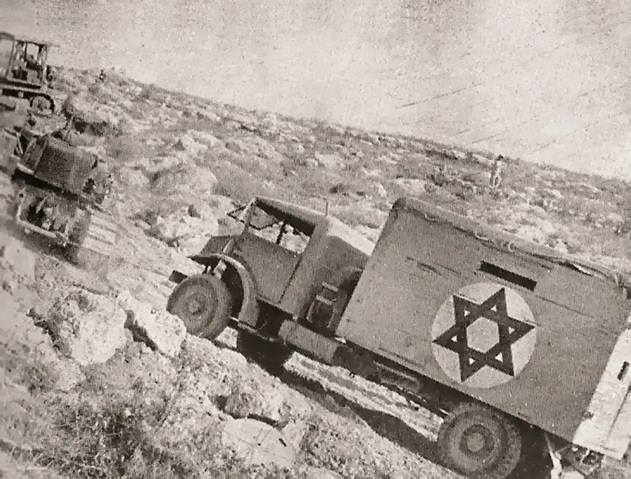 Truckloads of Jews driving along the "Derech Burma", 1948